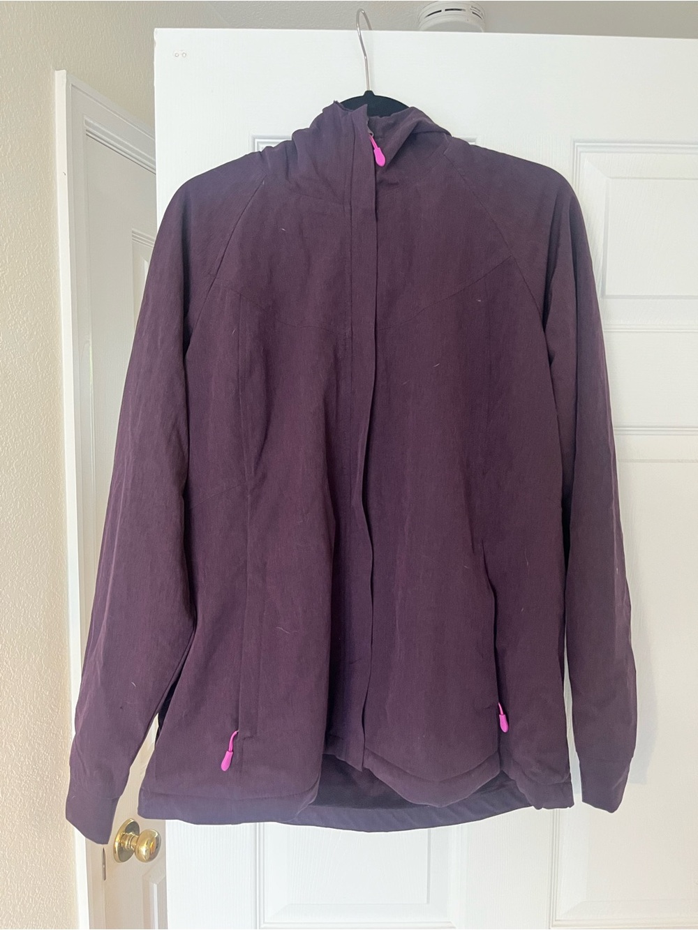Purple Kirkland Signature windbreaker jacket